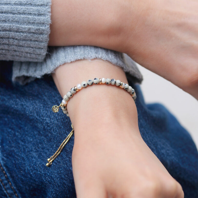 5mm near round freshwater pearl dalmatian stone bracelet with yellow gold plate sterling silver slider clasp