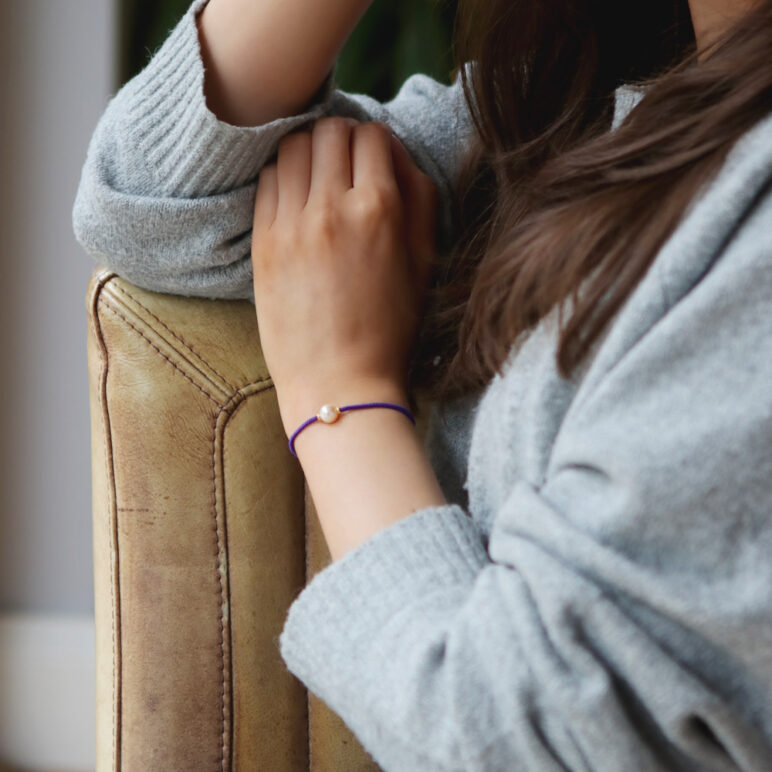 8mm freshwater pearl adjustable tassel bracelet on recycled plastic coloured thread
