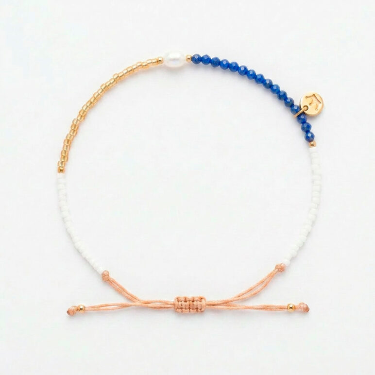 white 4mm oval freshwater pearl lapis stone drawstring bracelet with white and yellow gold coloured beads