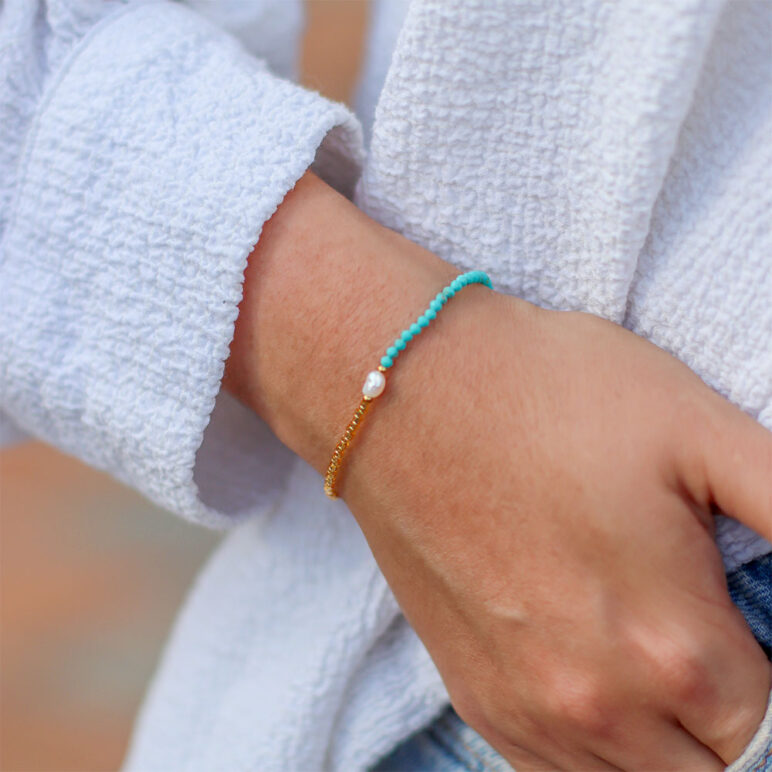 white 4mm oval freshwater pearl turquoise stone drawstring bracelet with white and yellow gold coloured beads