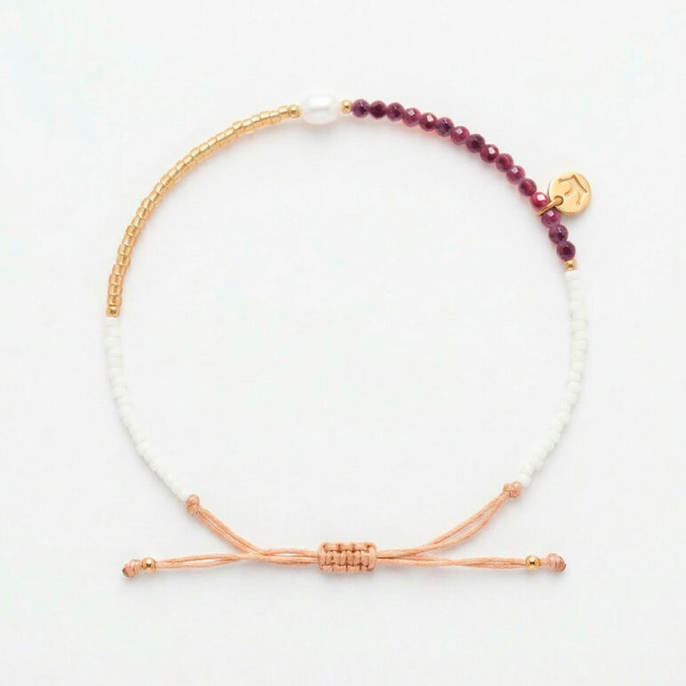 white 4mm oval freshwater pearl Garnet stone drawstring bracelet with white and yellow gold coloured beads