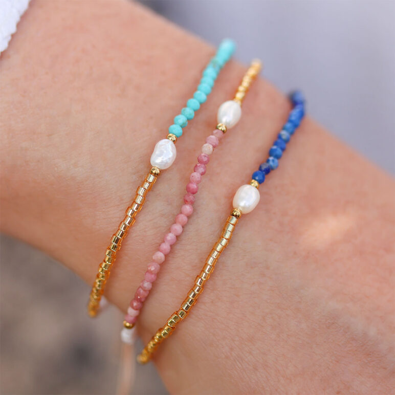 trio of white 4mm oval freshwater pearl drawstring bracelets with white and yellow gold coloured beads