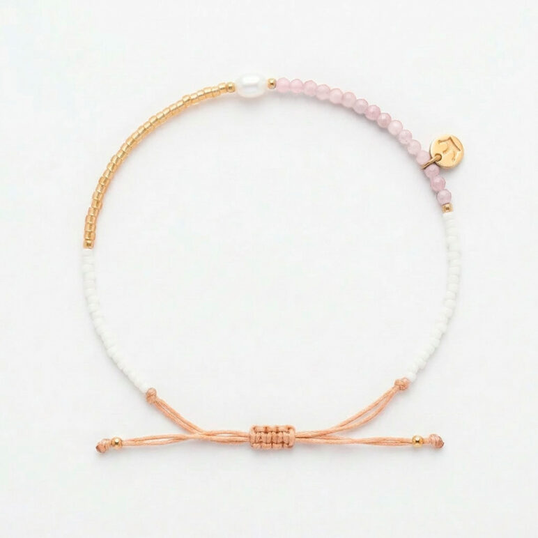 white 4mm oval freshwater pearl pink sunstone drawstring bracelet with white and yellow gold coloured beads