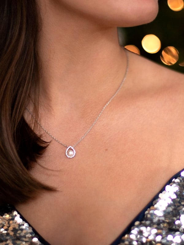 lady wearing amberley pearl necklace and sparkling party top