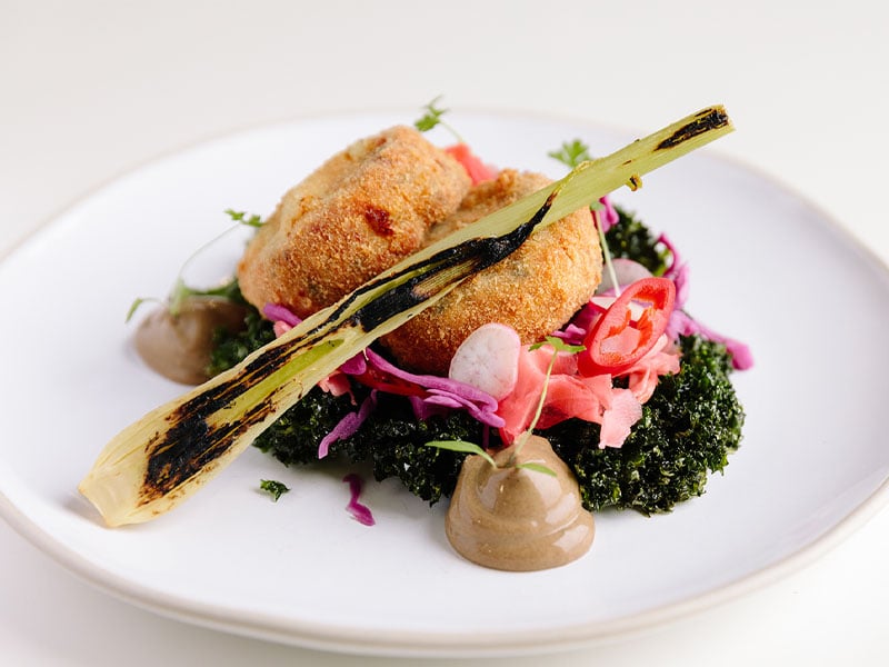 crab cakes served in the pearl cafe