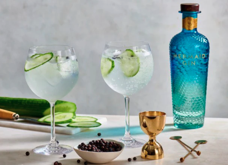 Photo of mermaid gin bottles and glasses